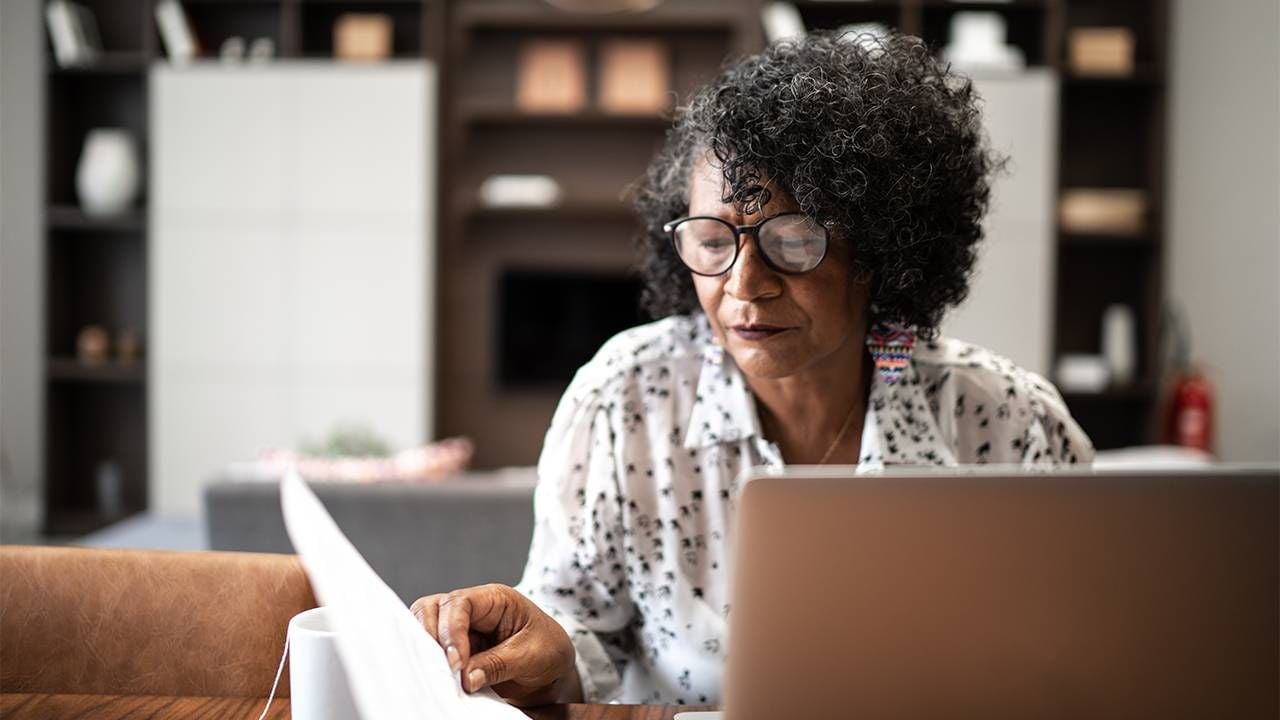 An older woman doing research on her computer at home. Caregiver, caregivers, Next Avenue