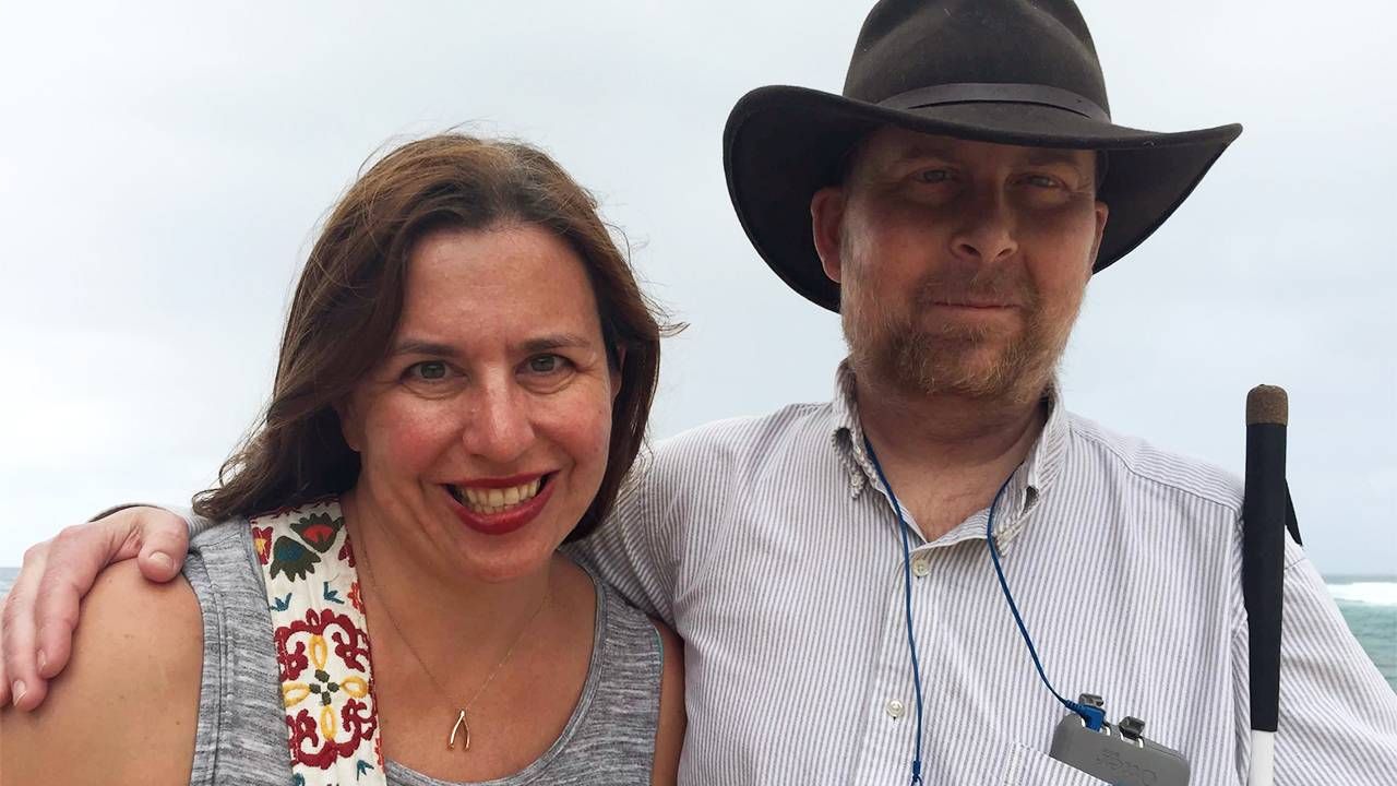 Author, Kate, and her husband smiling on the beach, caregiver, caregiver, burnout, Next Avenue