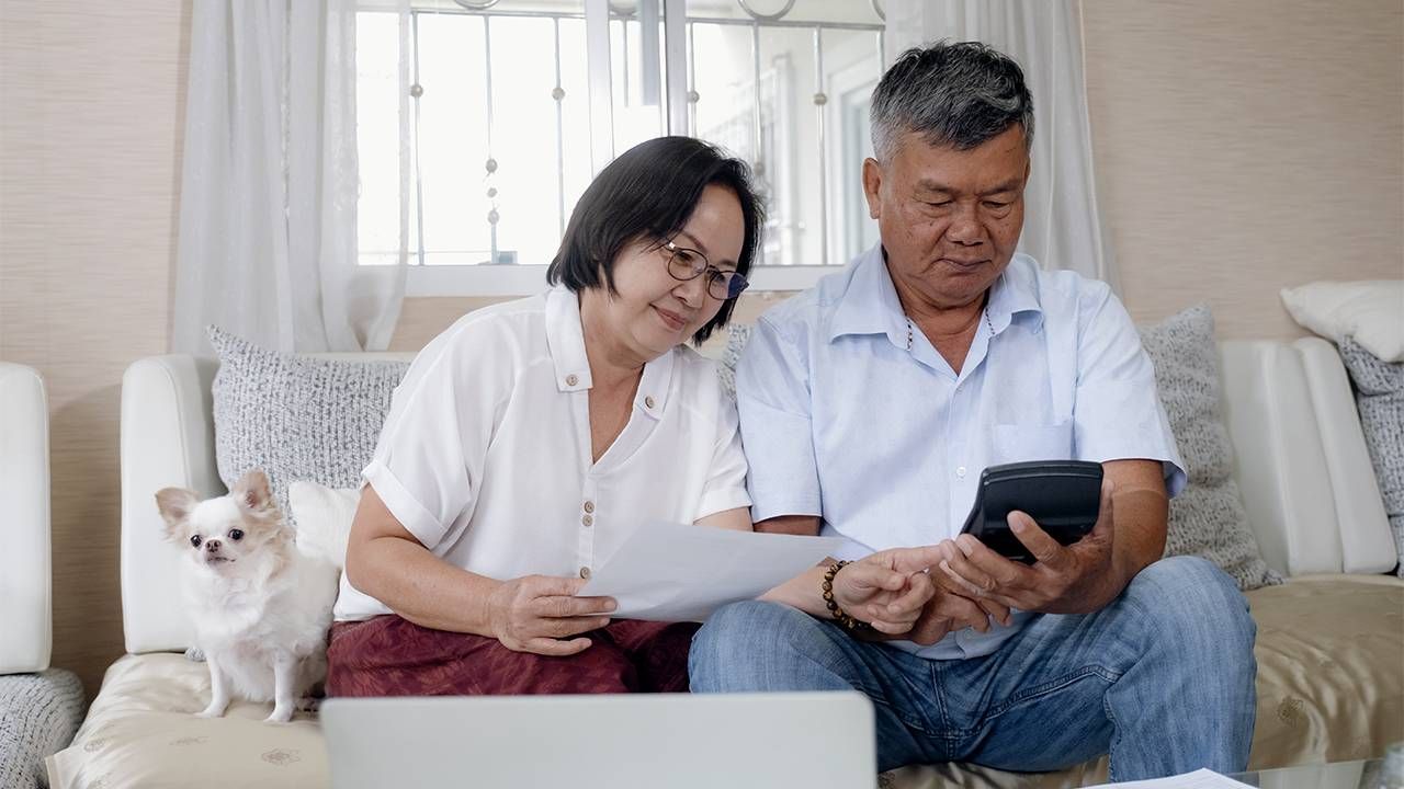 An older couple calculating and planning for retirement.