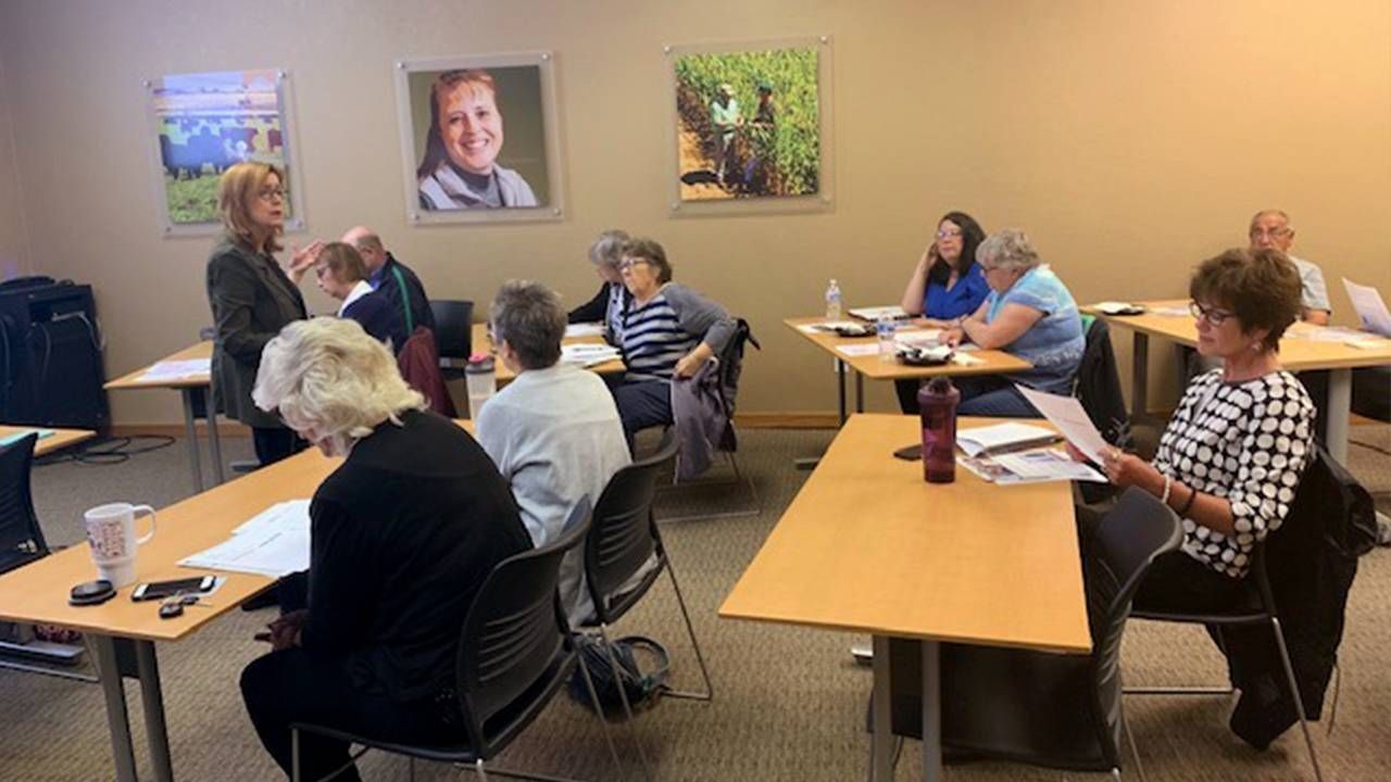 A woman leading a class of older adults. Older workers, age diversity, Colorado, Next Avenue