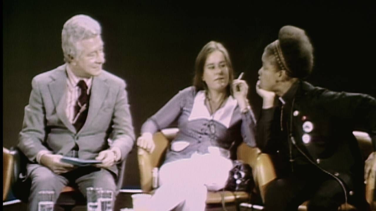 An old photograph of LGBT activists on a TV program. 'CURED' documentary, Next Avenue