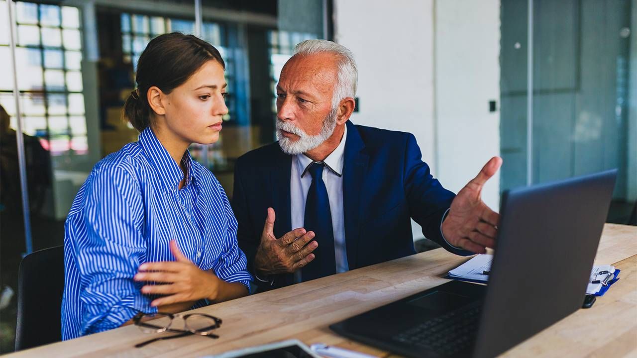 A older worker and a younger worker looking frustrated. Ageism, young people, Next Avenue