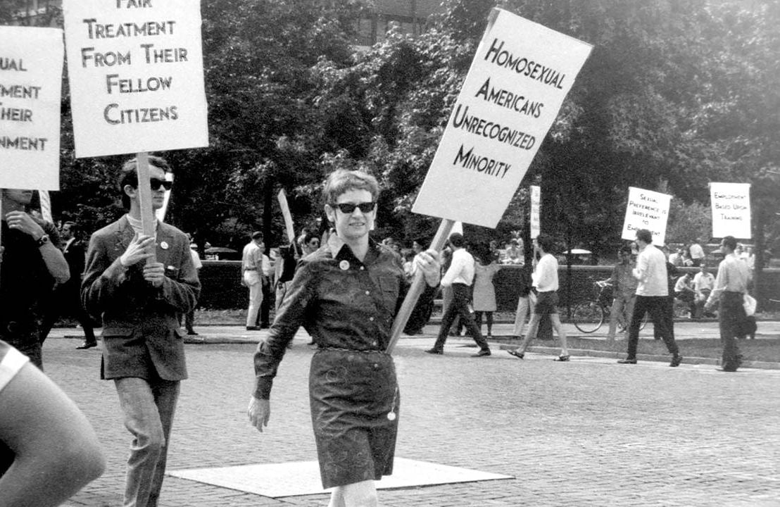 An old photograph of LGBT activists marching with signs. 'CURED' documentary, Next Avenue