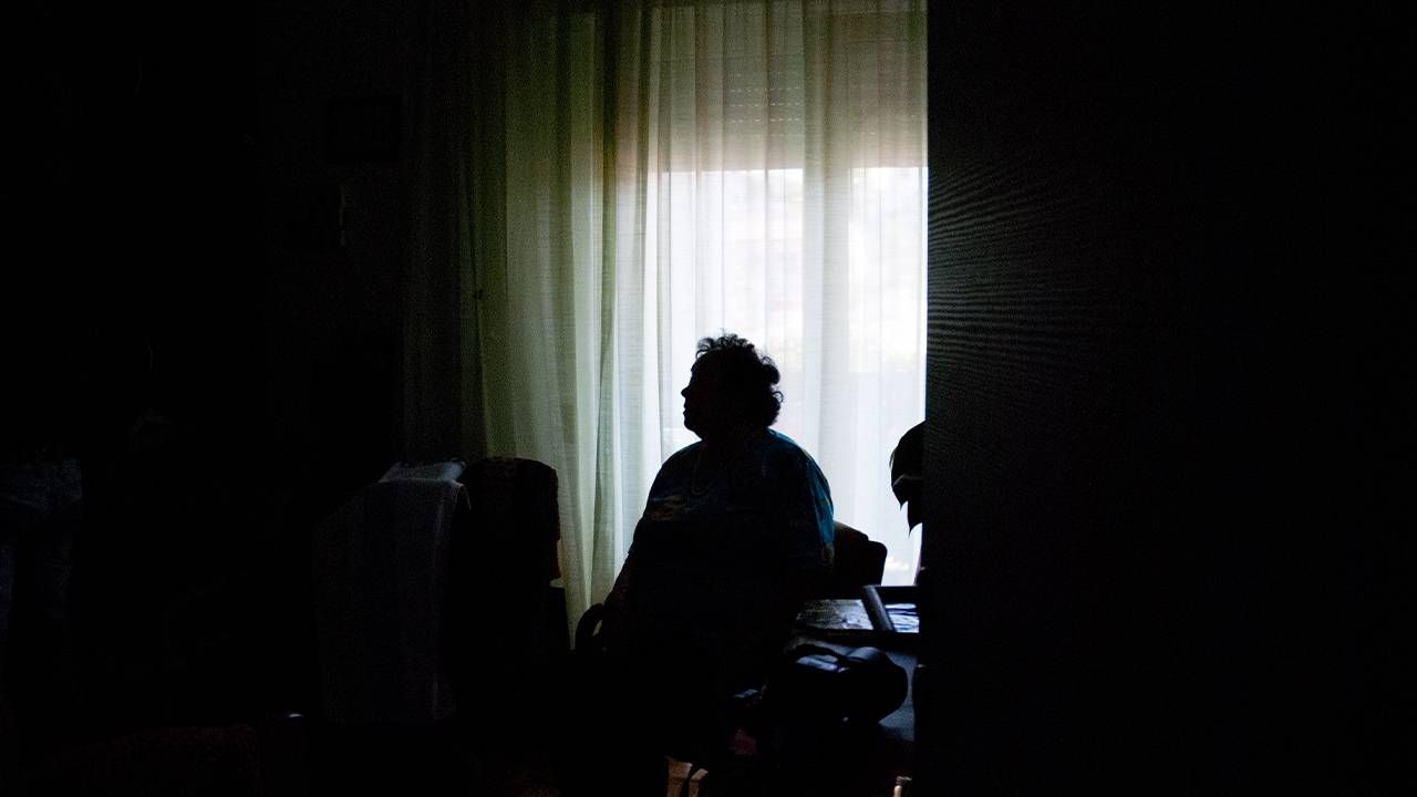 The silhouette of a person in front of a window. Loneliness, isolation, alone, Next Avenue