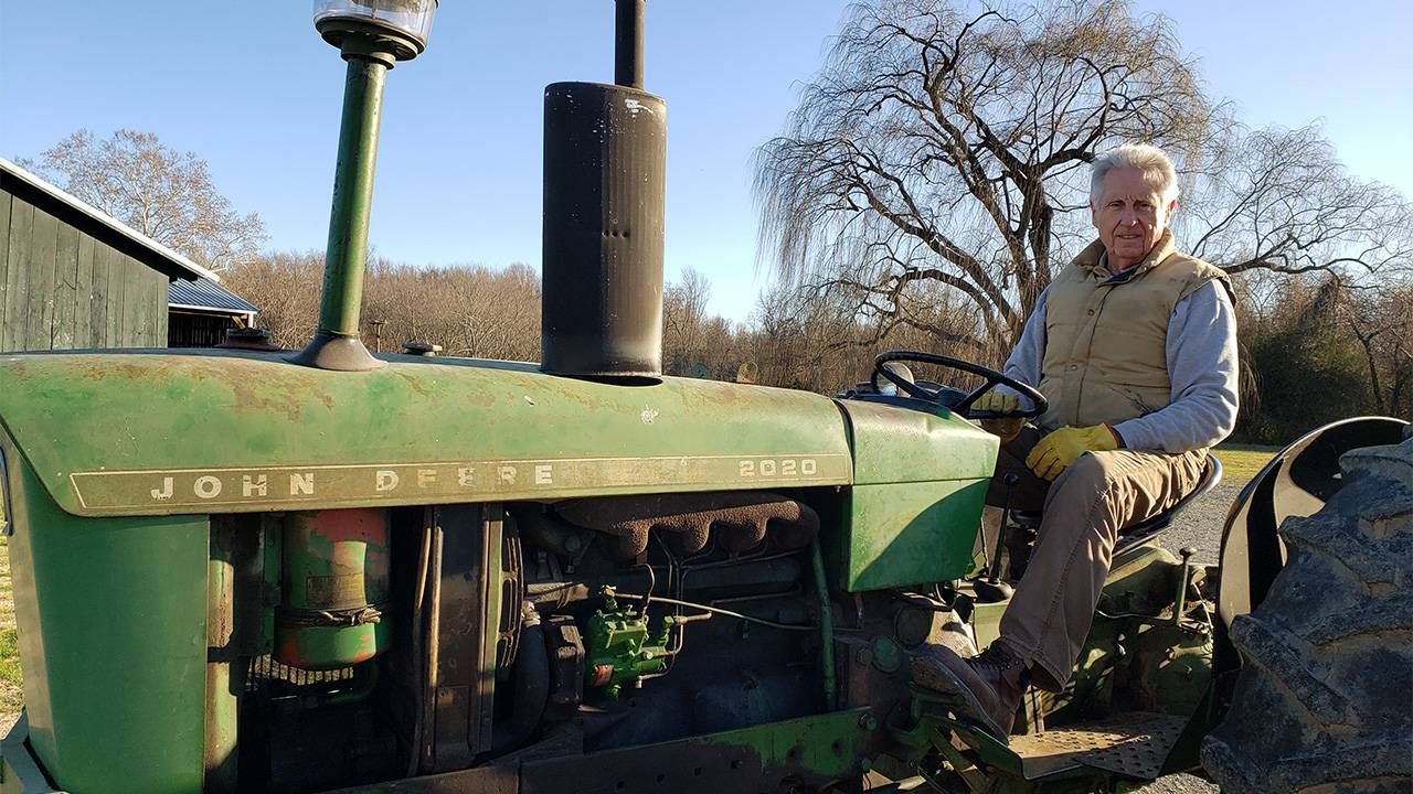 An older mean sitting on a tractor outside. Older entrepreneurs, business, innovations, Next Avenue
