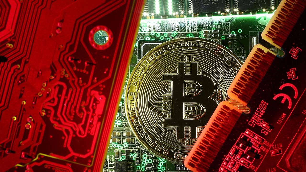 A Bitcoin coin next to computer microchips. Cryptocurrency, Bitcoin, Next Avenue