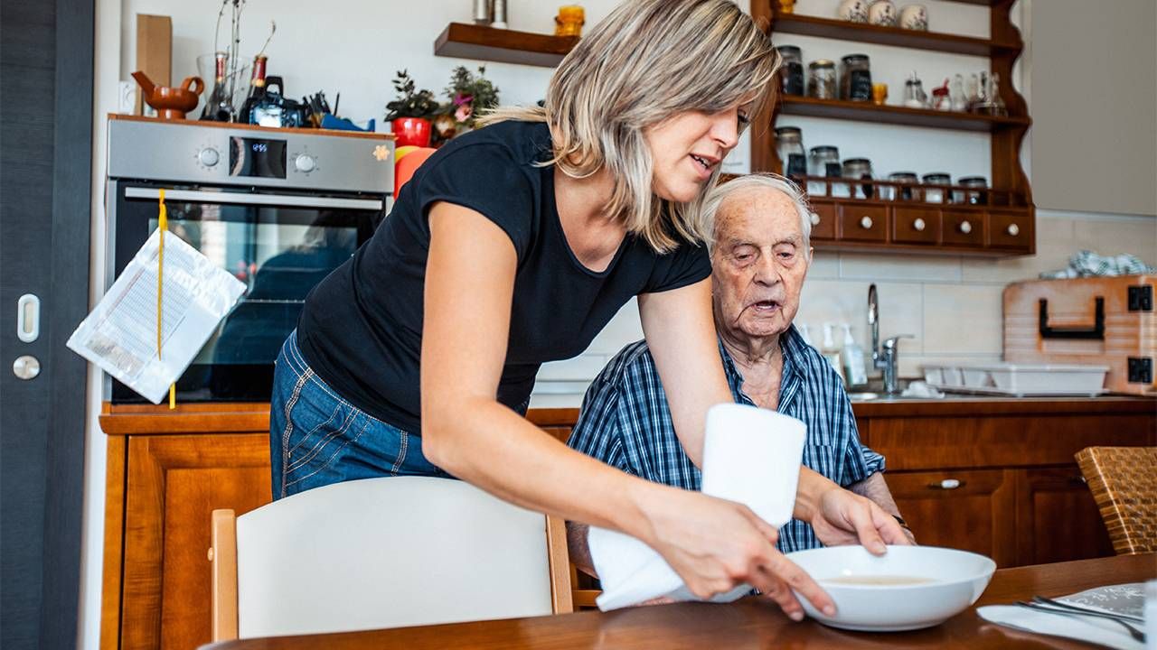 A caregiver taking care of a dementia patient. Alzheimer's, Next Avenue