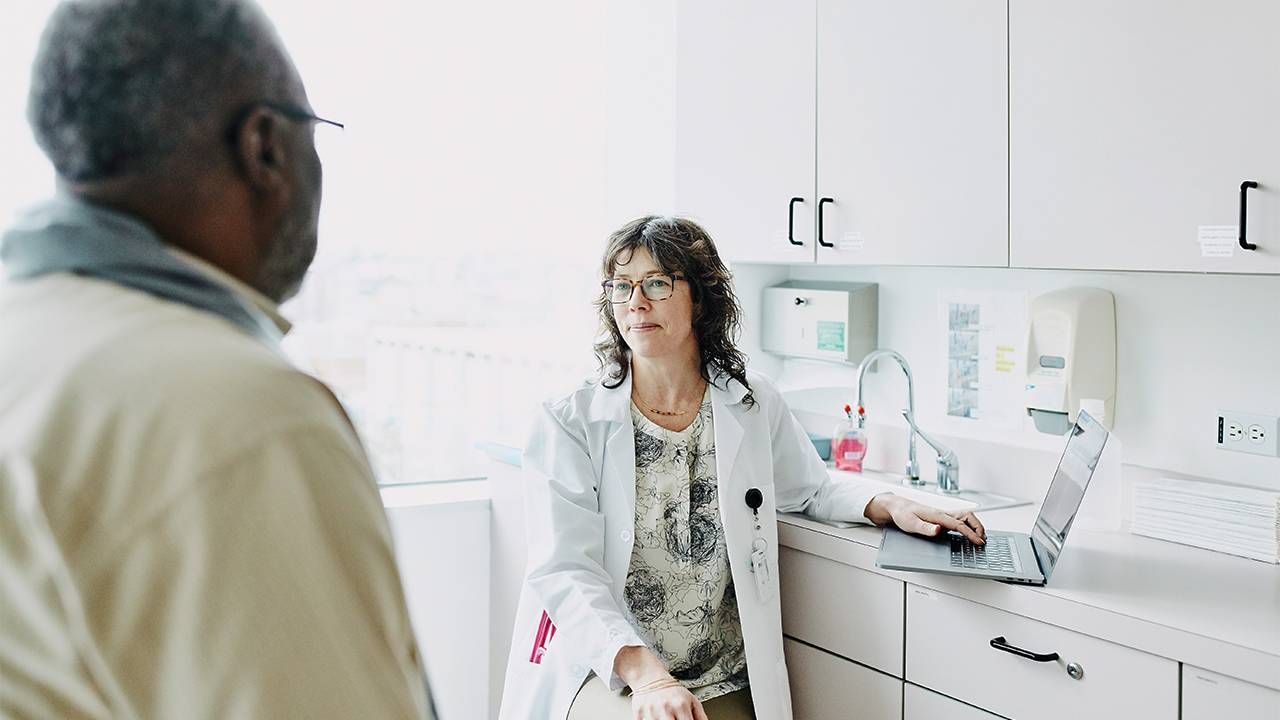 An older adult at the doctor's office. Dementia, Alzheimer's, cognitive screenings, Next Avenue