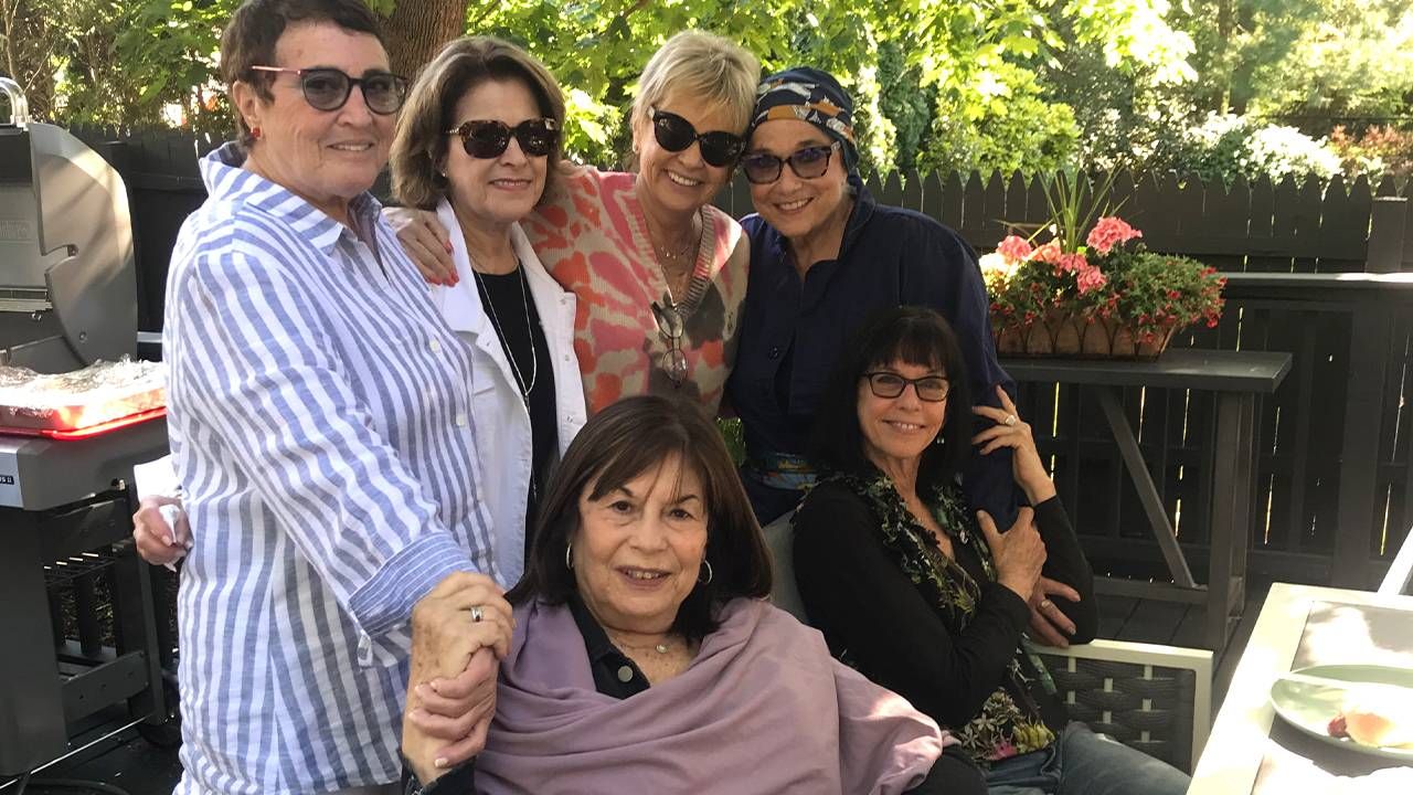 A group of friends together at an outdoor patio. Friends, friendship, Next Avenue