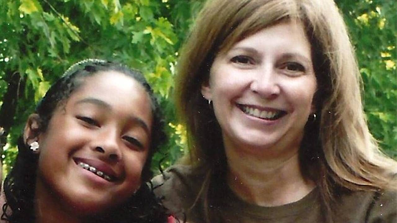 A grandmother and her granddaughter smiling. Racism, grandmother, Next Avenue