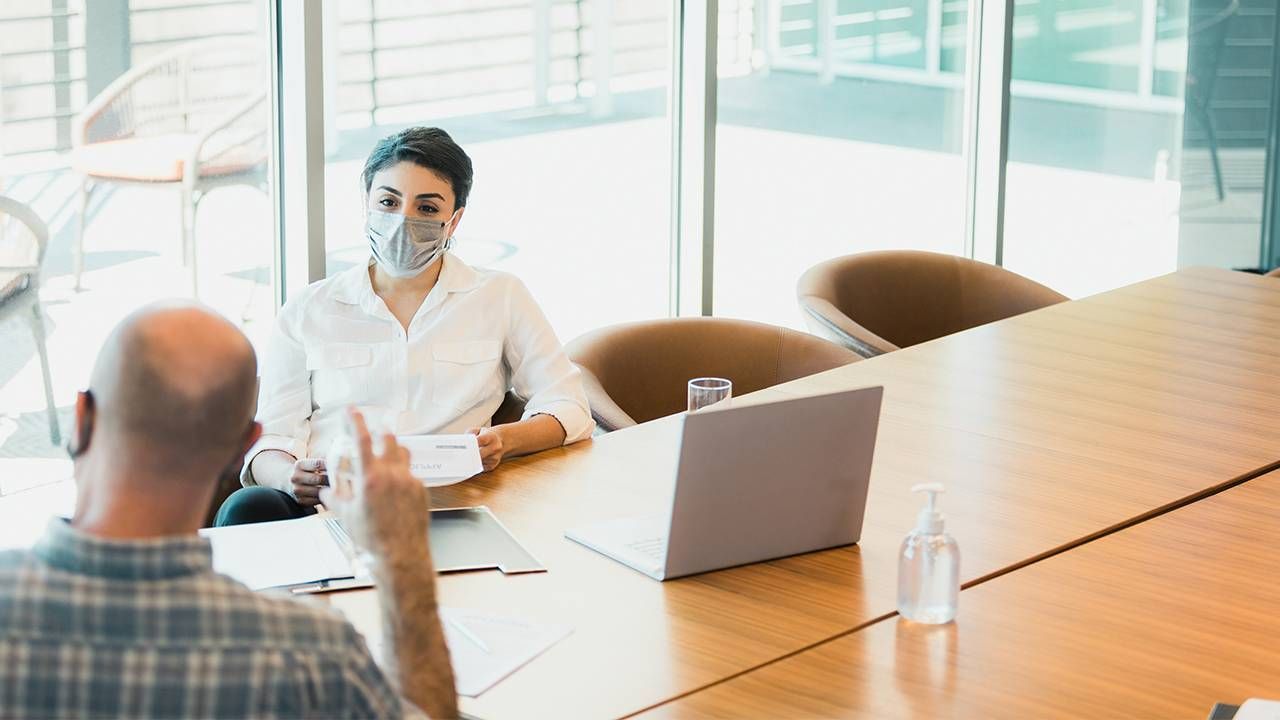 A woman interviewing a man for a job. Flexible work, interview, Next AVenue