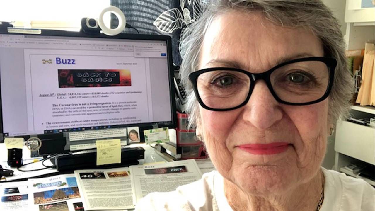 A woman sitting in front of a desk wearing glasses. The Buzz, COVID-19, Independent living, Next Avenue