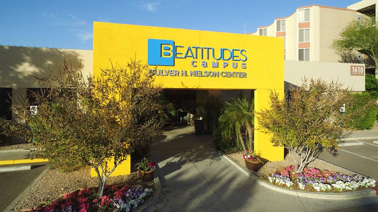 the outside lobby of the Beatitudes Campus building. Next Avenue, LGBTQ housing