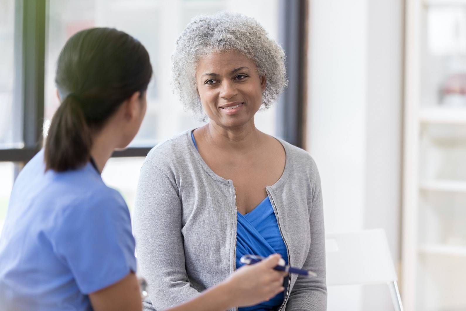 woman talking to medial professional