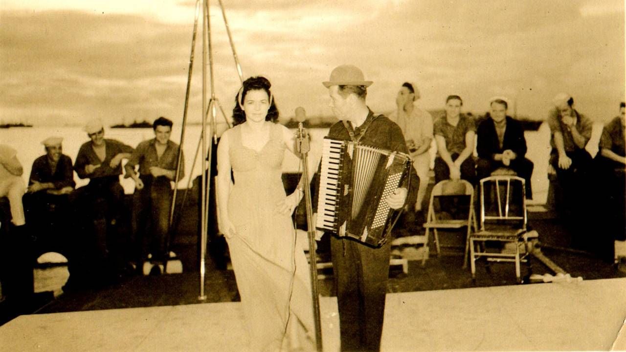 The authors great-grandmother wearing a gown standing on stage. Next Avenue, circus