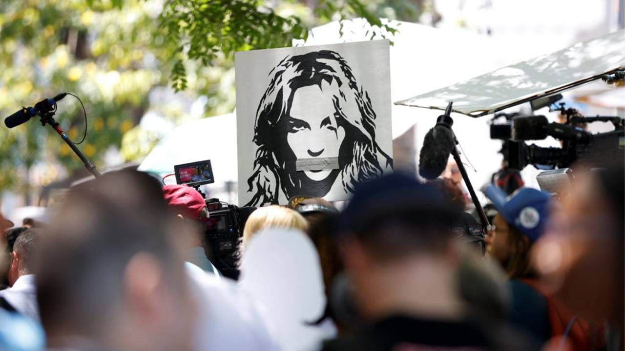 Protesters holding up a "free Britney" poster. Conservatorship, Britney Spears,Next Avenue,