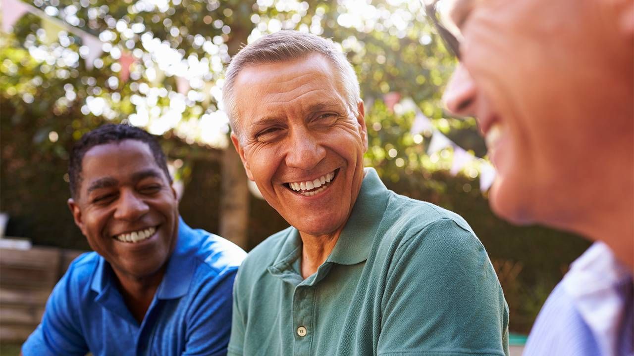 A group of male friends talking to each other. Next Avenue, conversations, friendship, health