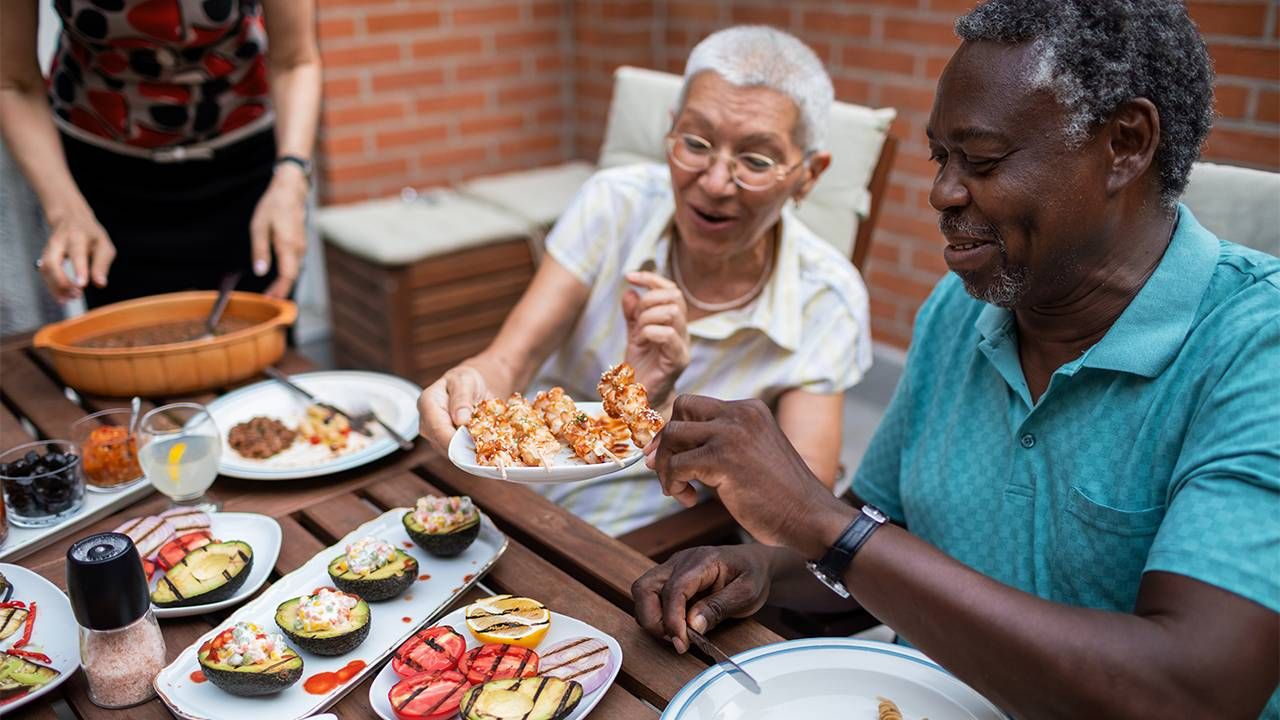 Older adults sharing a healthy barbecue. Next Avenue, BBQ, fourth of july