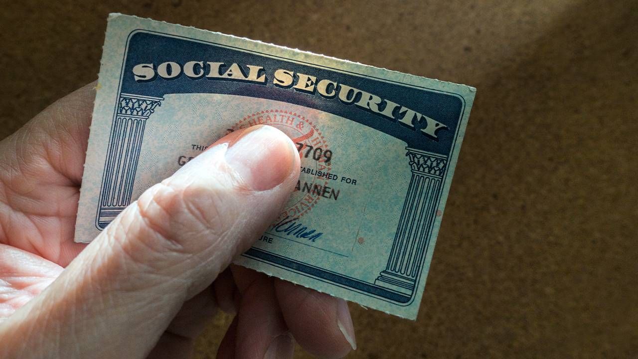 A person holding their social security card. Next Avenue, when to claim social security