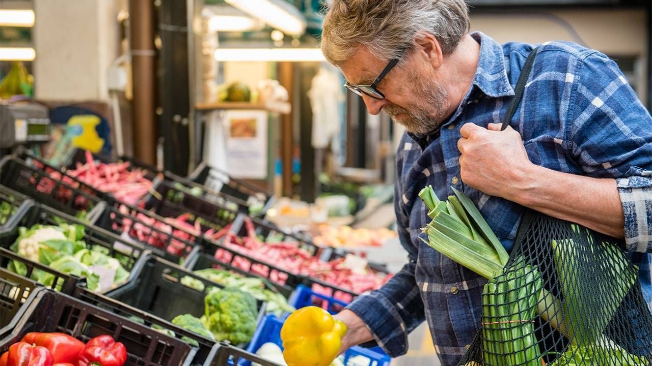 A man shopping at the grocery store. Next Avenue, solo aging