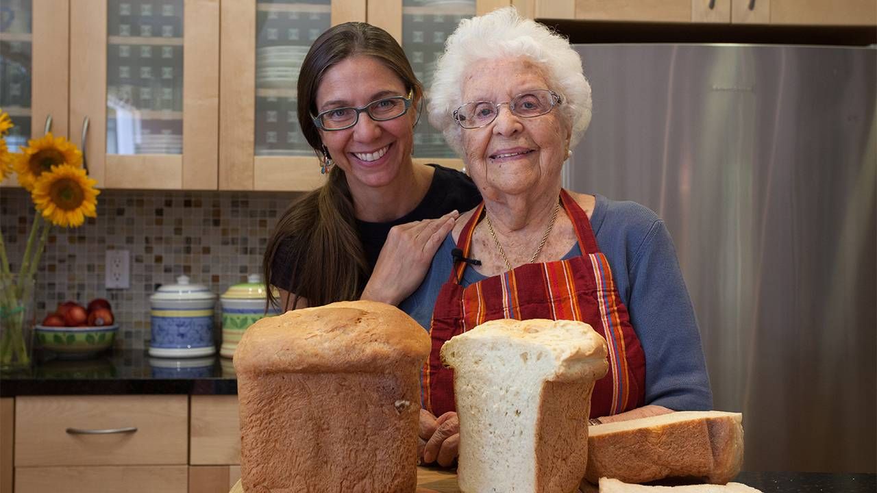 The filmmaker and her grandmother smiling in the kitchen. Next Avenue, Lives Well Lived Documentary