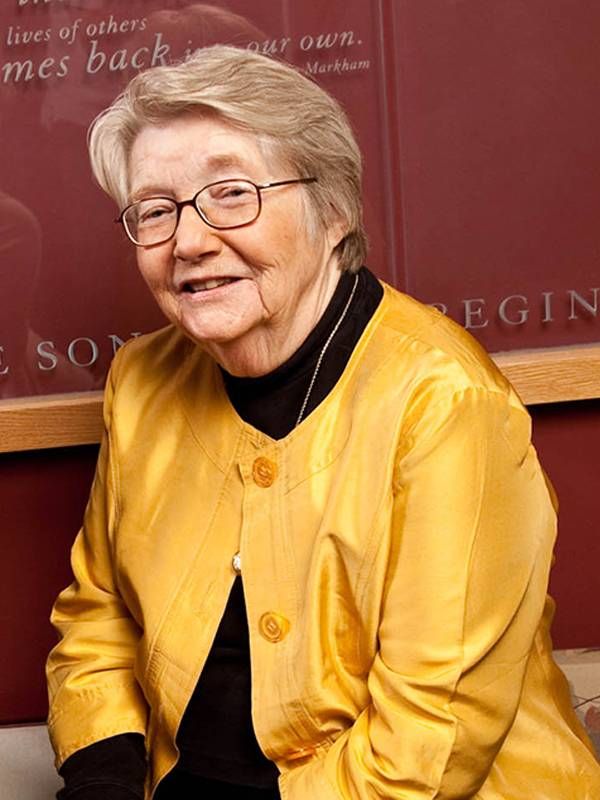 Peg Geisler wearing a yellow jacket, smiling. Next Avenue, Metastatic Breast Cancer