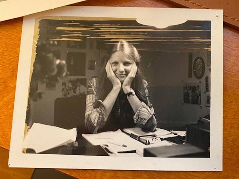 An old photo of Sandi Bachom smiling at a desk. Next Avenue, documentary filmmaker