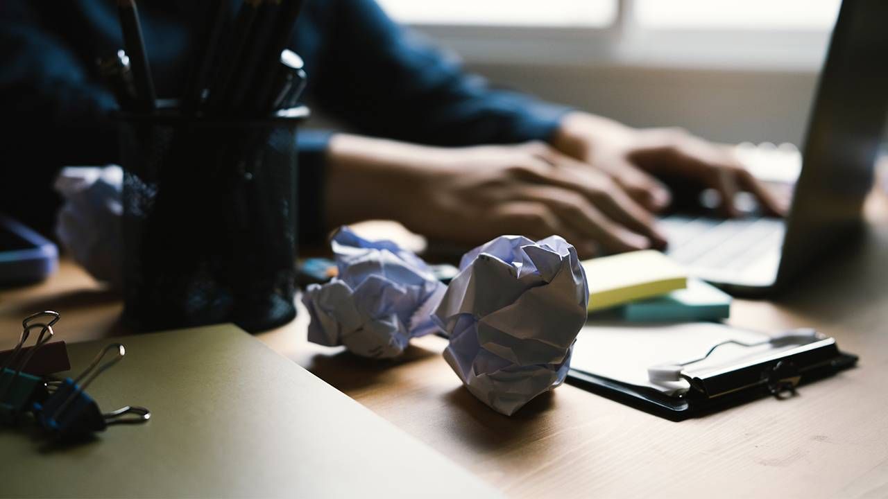 Crumpled paper on a desk. Next Avenue, ageism, jobs