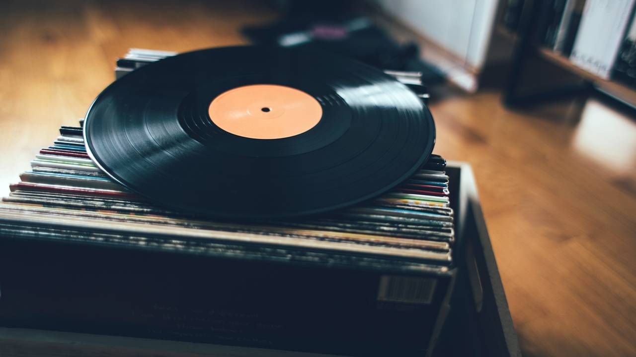 A box of records with an LP on top. Next Avenue, brother, rock music