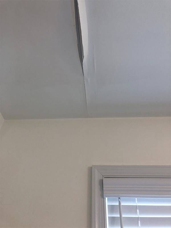 A crack in a ceiling with water damage. Next Avenue, laptop, computer