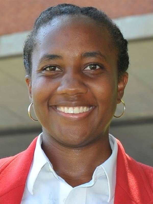 Ionnie McNeill wearing a red blazer. Next Avenue, investment club