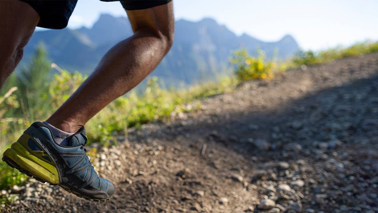 A person's legs running on a trail. Next Avenue, trail running