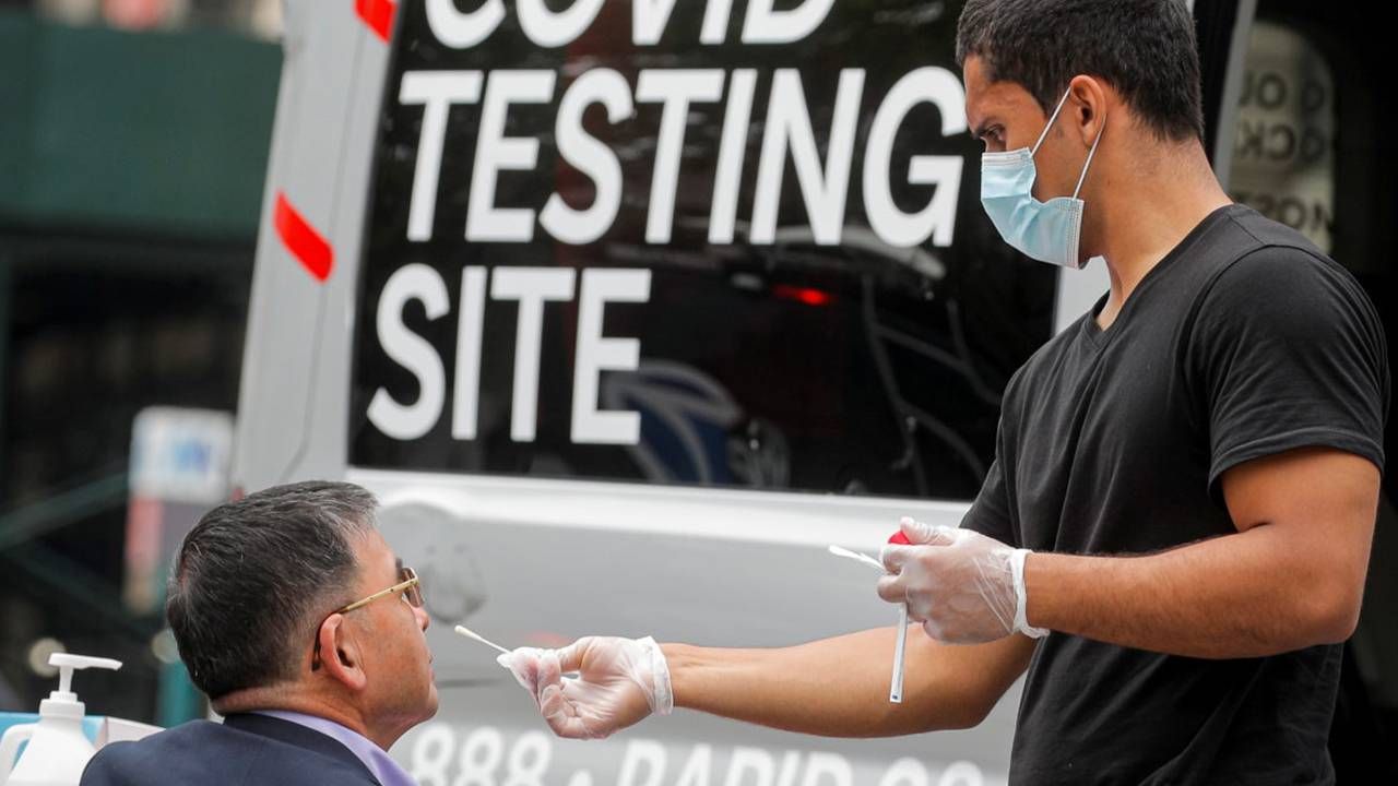 A patient getting a COVID-19 nasal swab test. Next Avenue, vaccinated, breakthrough infection