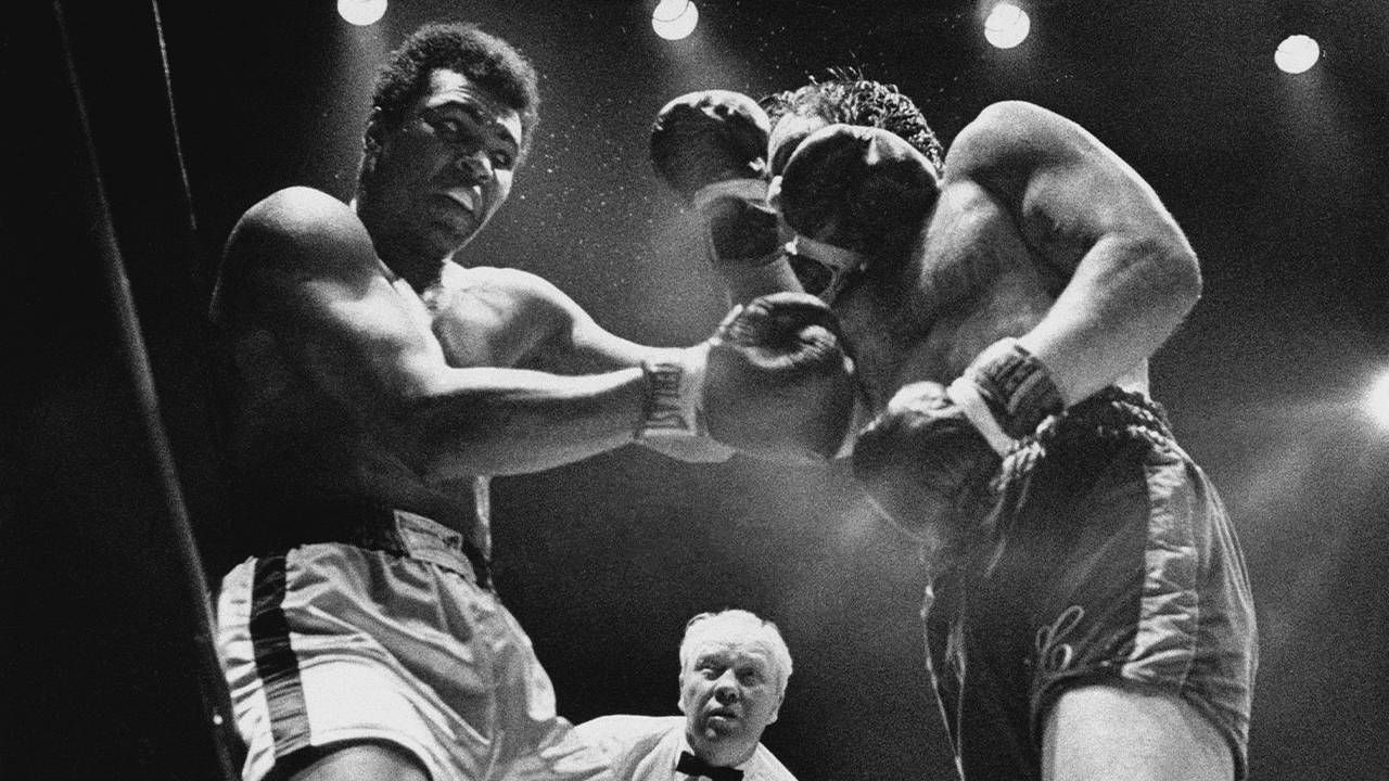 A black and white photo of Muhammad Ali during a boxing match. Next Avenue, Muhammad Ali, PBS