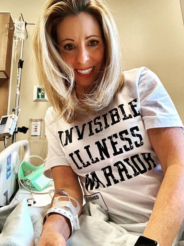 A woman in a hospital bed, smiling. Next Avenue, MS, multiple sclerosis