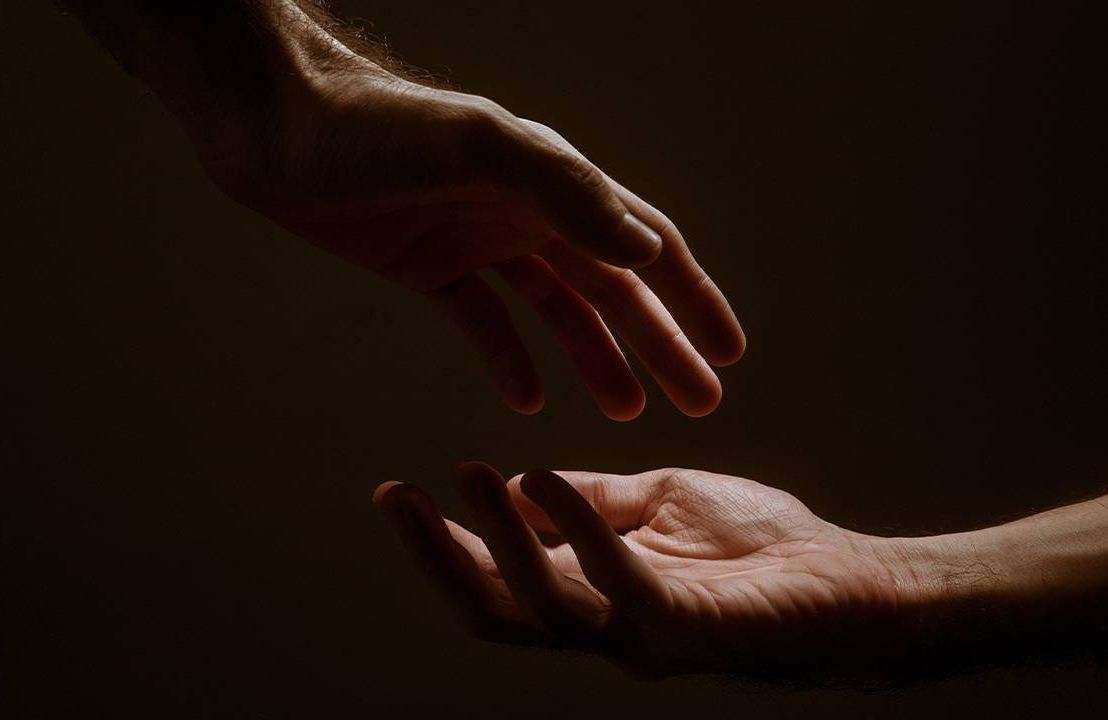 Two hands illuminated with a soft light. Next Avenue, illness, spirituality, spiritual practice, Connie Zweig