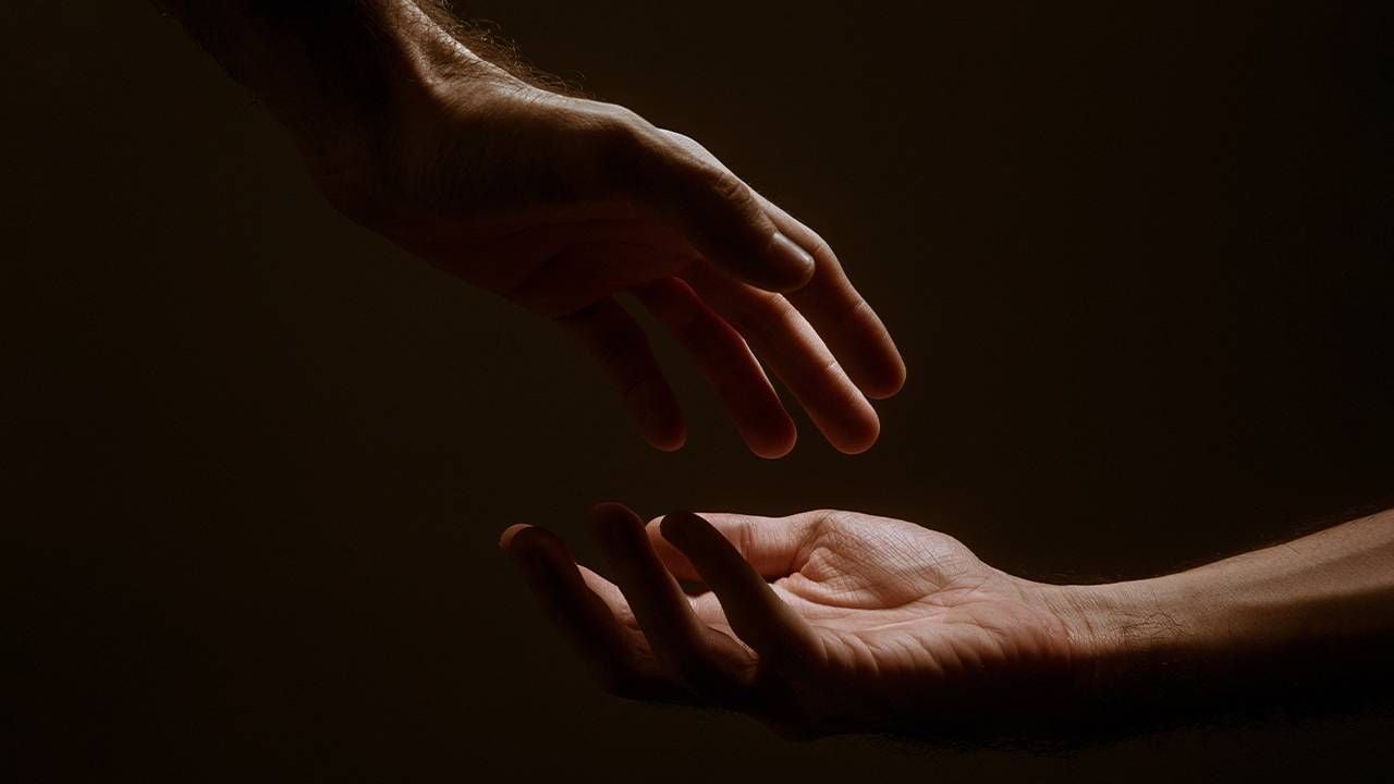 Two hands illuminated with a soft light. Next Avenue, illness, spirituality, spiritual practice, Connie Zweig