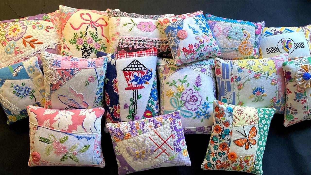 A group of colorful quilted pillows. Next Avenue, vintage, repurposing, crafts