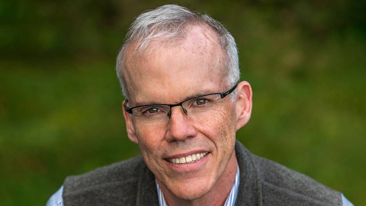 A man wearing a wool vest and shirt smiling while standing outside. Next Avenue, Bill McKibben, environmentalist, Third Act