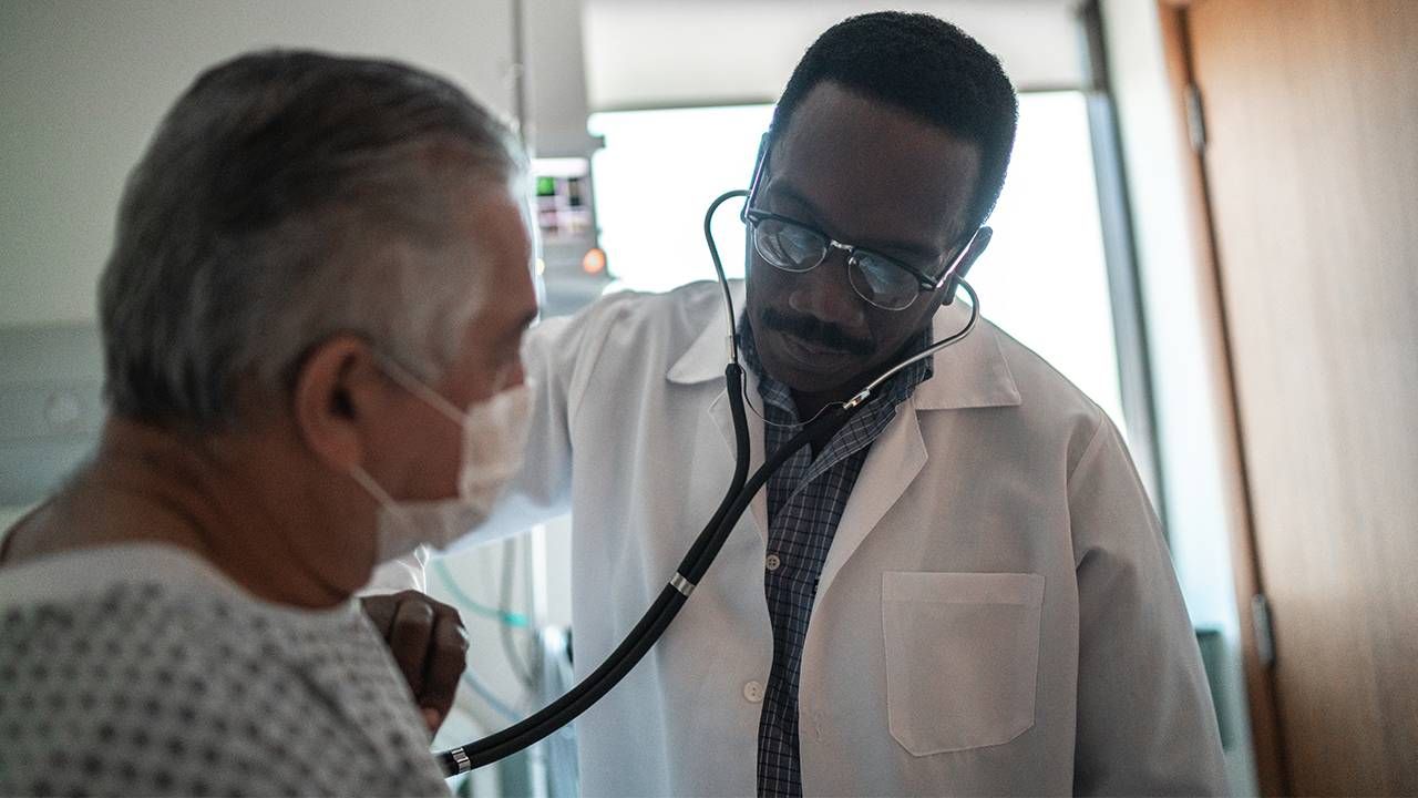 A geriatrician listening to a older patient's hearbeat. Next Avenue, age-friendly health care, geriatric medicine