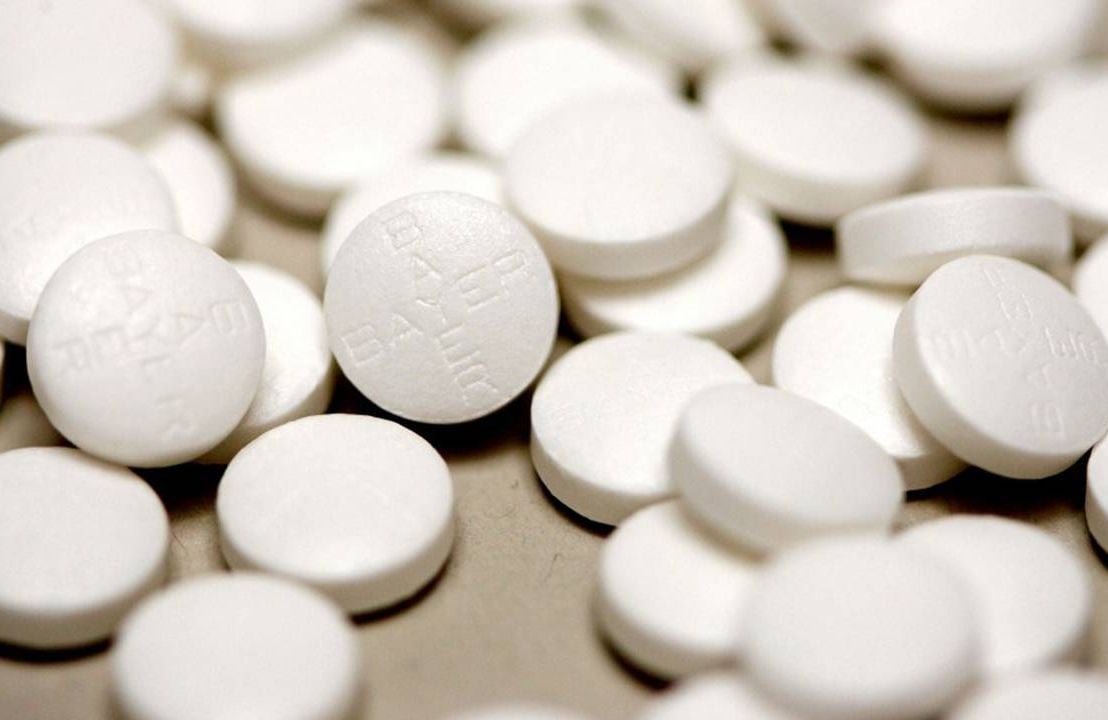 Several small white Bayer baby aspirin pills. Next Avenue, heart attack, stroke, prevention, taking aspirin safe
