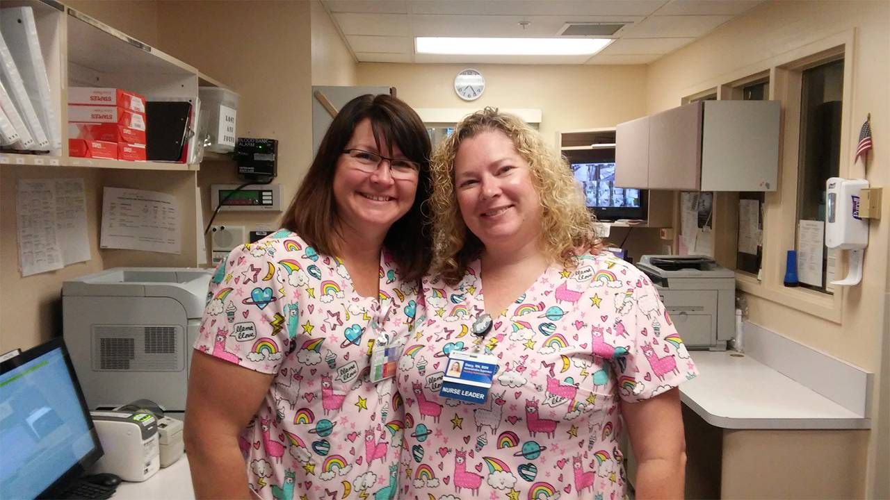 Two CNAs working amid a health care worker shortage. Next Avenue