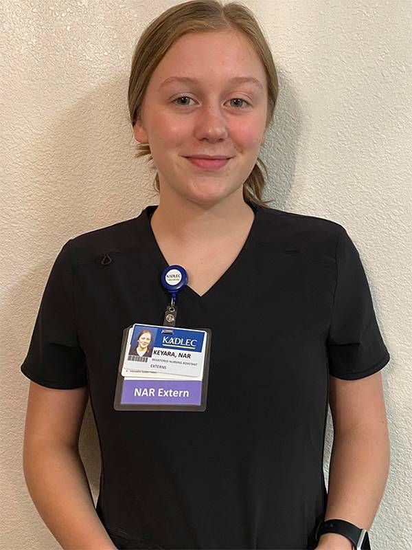 A young CNA health care worker wearing a hospital badge. Next Avenue