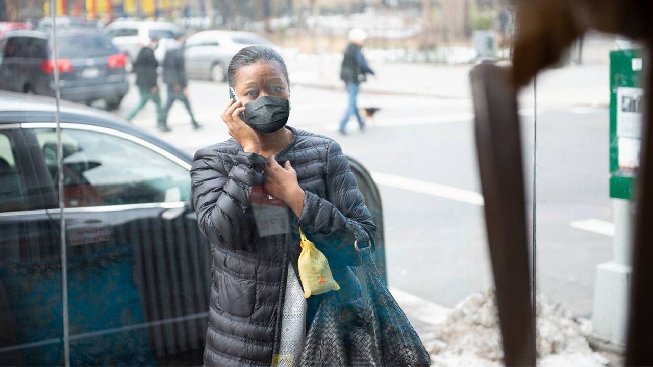 A woman on the phone looking worried. Next Avenue, mammogram screening call back, mammogram callback