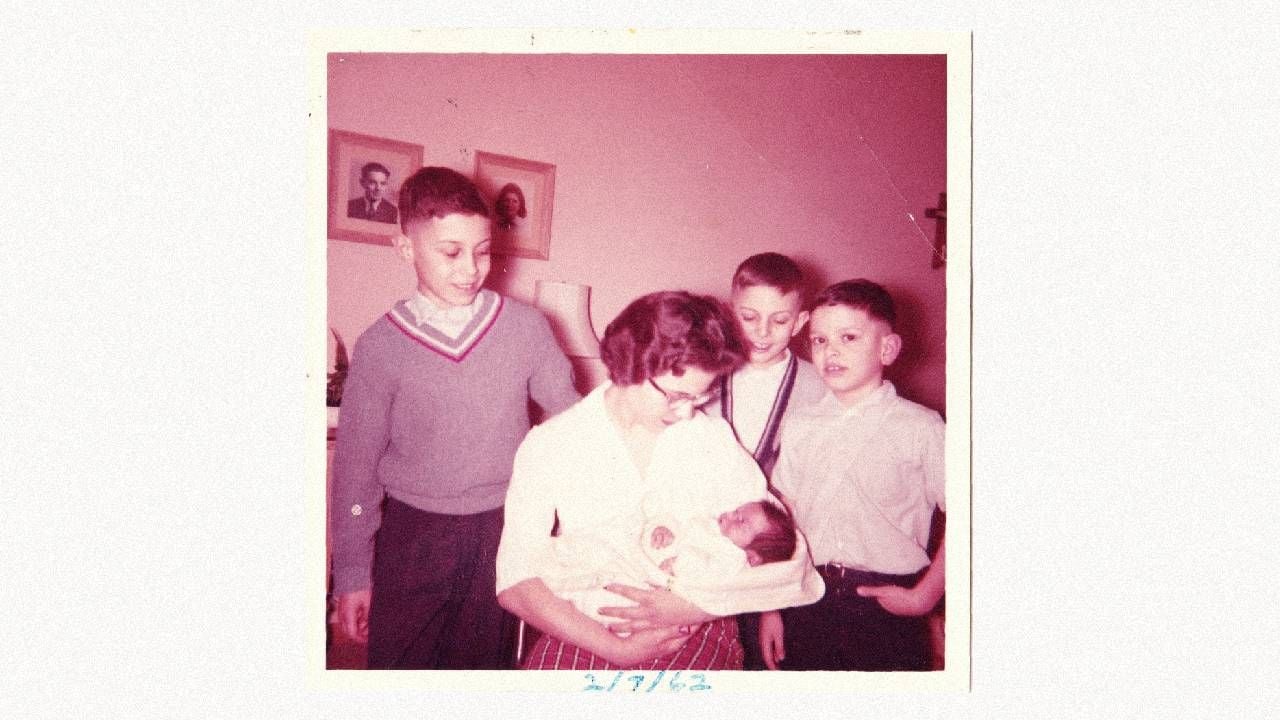An old photo of a family holdng a newborn. Next Avenue, siblings, sibling relationships, forgiving family