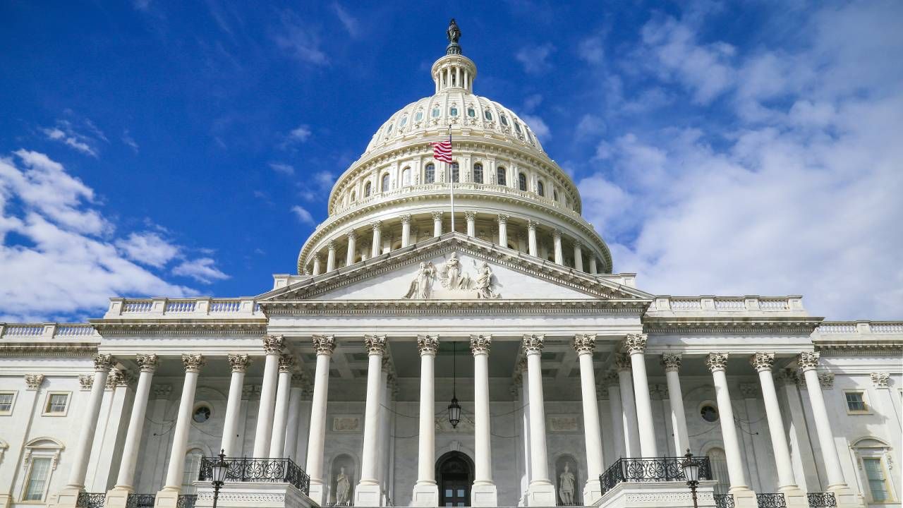 The U.S. Capitol building against a blue sky. Next Avenue, Build Back Better Act, BBB