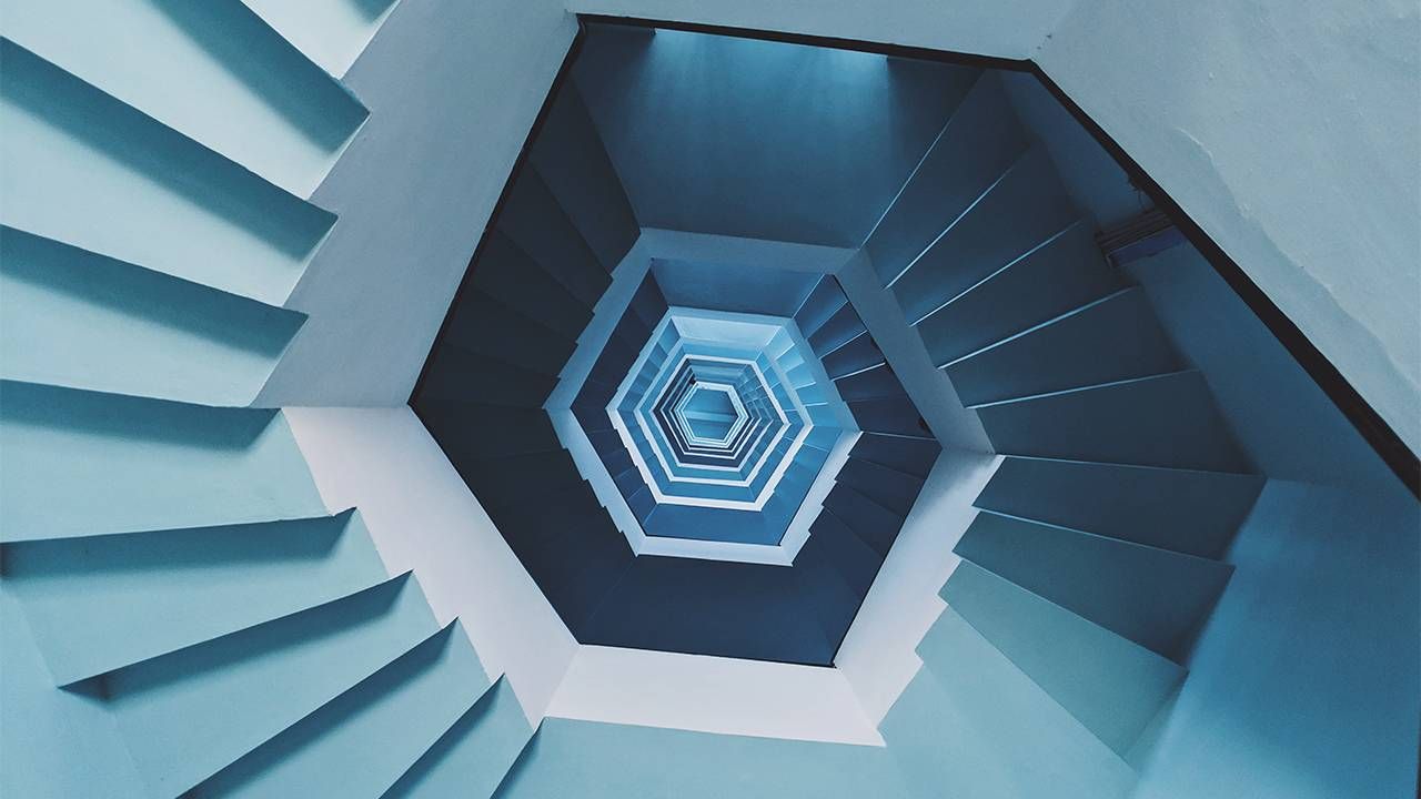Looking down the center of a spiral staircase. Next Avenue, vertigo signs symptoms, Meniere's disease