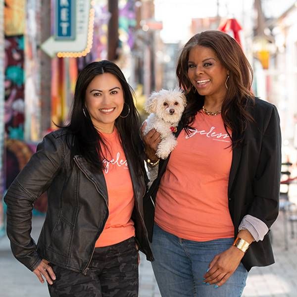 Headshot two women holding a dog standing outside. of a Next Avenue