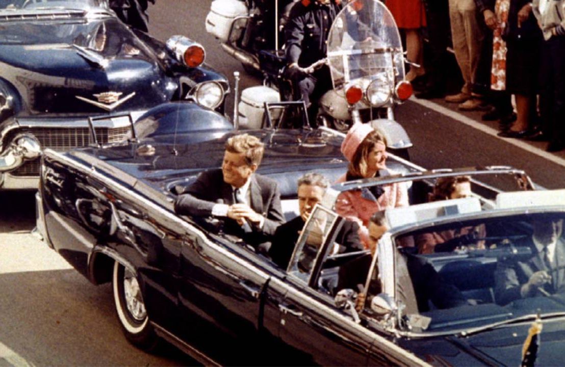 President and Mrs. John F. Kennedy riding in a car in Dallas. Next Avenue