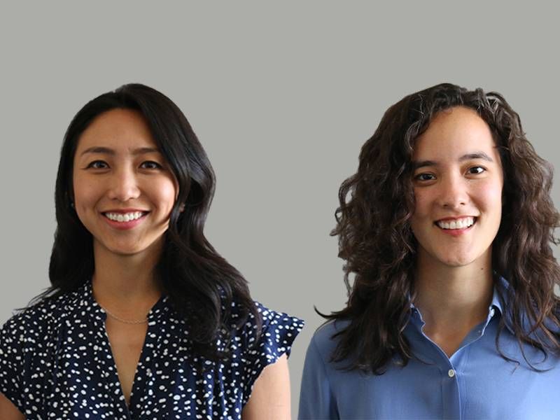 Two young people smiling in front of a grey background. Next Avenue